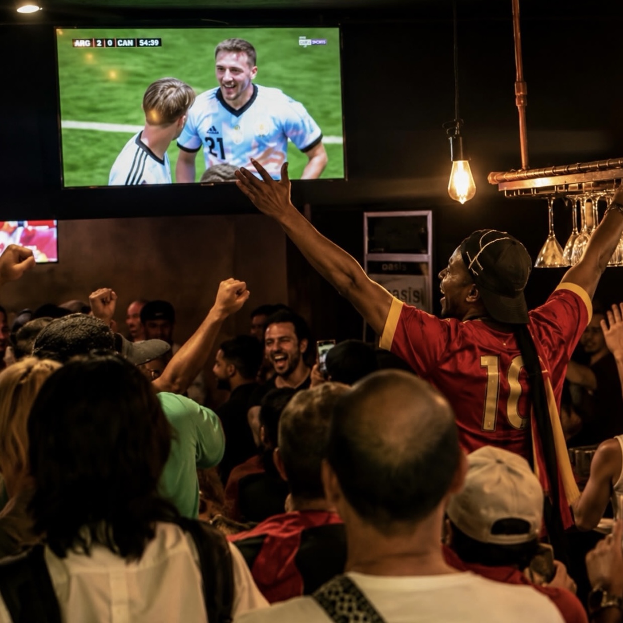 Excited fans watching game at DownTown bar