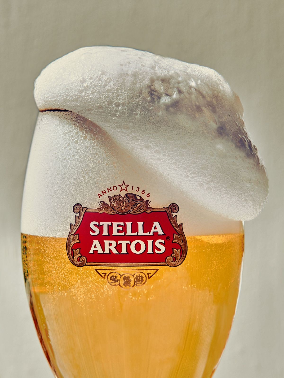 Stella Artois crowned with foam in a clean golden pour
